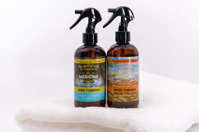 Two spray bottles of Medicine Springs product. These are the Joint Formula and Sport Formula mineral therapy.